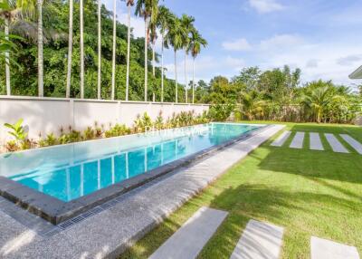 Modern backyard with a swimming pool and landscaped garden