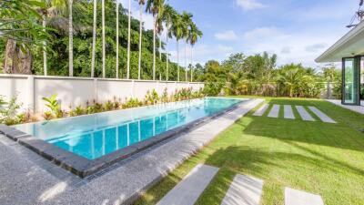 Modern backyard with a swimming pool and landscaped garden