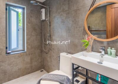 Modern bathroom with shower, mirror, and sink