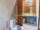 Modern bathroom with large mirror and wooden elements