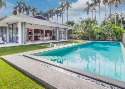 Outdoor view of a house with modern pool and patio