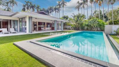 Outdoor view of a house with modern pool and patio