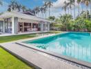 Outdoor view of a house with modern pool and patio