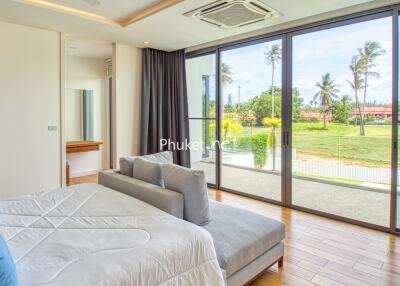 Spacious bedroom with large windows and a beautiful view