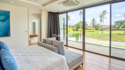 Spacious bedroom with large windows and a beautiful view