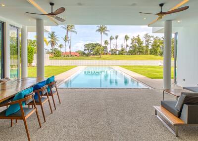 Outdoor living area with pool and garden view