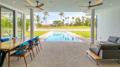 Outdoor living area with pool and garden view