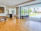 Spacious living and dining area with pool view