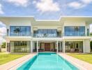 Front view of a modern two-story house with swimming pool