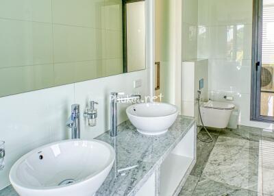 Modern bathroom with dual sinks and marble countertop