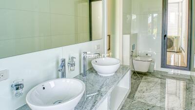 Modern bathroom with dual sinks and marble countertop