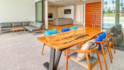 Modern open-plan living and dining area with sliding glass doors.