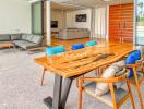 Modern open-plan living and dining area with sliding glass doors.