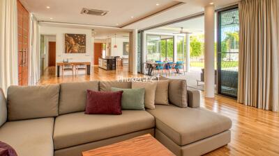 Spacious living room with modern furniture and large windows