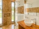 Modern bathroom with wooden countertop and glass shower