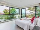 Spacious bedroom with large windows and a beautiful view