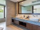 Modern bathroom with dual sinks and large mirror