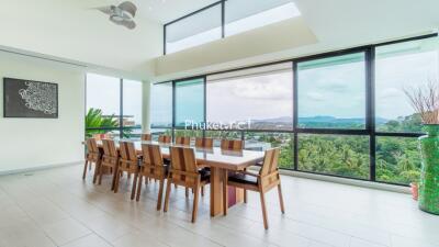 Spacious dining area with large windows and scenic views