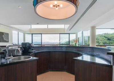 modern kitchen with appliances and large windows