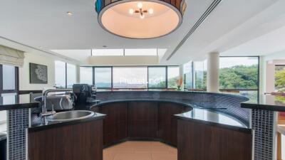 modern kitchen with appliances and large windows