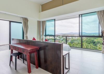 Modern bedroom with large windows and a scenic view