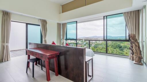 Modern bedroom with large windows and a scenic view