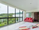 Modern bedroom with large windows and a scenic view