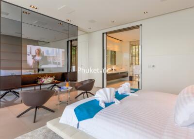 Modern bedroom with stylish decor and attached living area