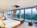 Spacious bedroom with large windows and a view