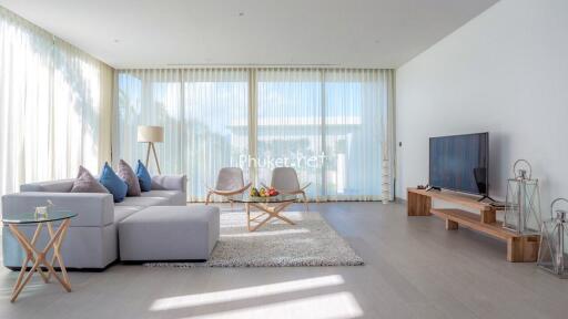 Modern living room with large windows and natural light