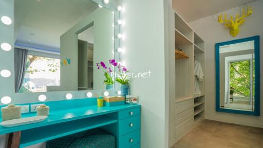 Modern bedroom with vanity and large mirror