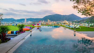 Infinity pool with city and mountain view