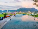 Infinity pool with city and mountain view