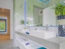 Modern bathroom with double sinks and decorative elements