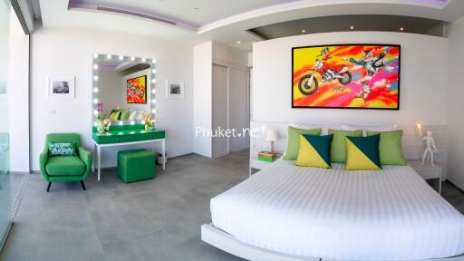 Modern bedroom with colorful artwork and large bed