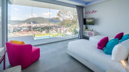 Spacious bedroom with city view