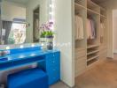 walk-in closet with vanity and open wardrobe