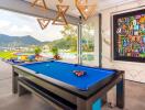 Spacious entertainment area with pool table and scenic view