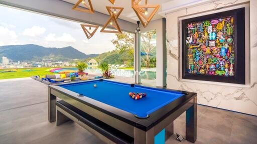 Spacious entertainment area with pool table and scenic view