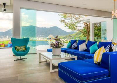 Modern living room with mountain view and blue furniture