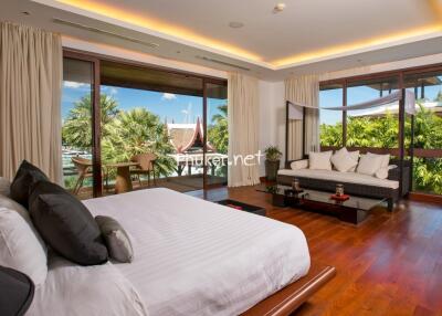 Spacious bedroom with a stunning outdoor view and modern furnishings