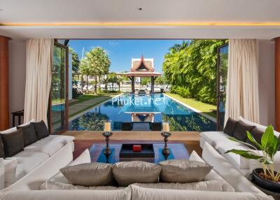 Spacious living room with pool view in a luxury villa