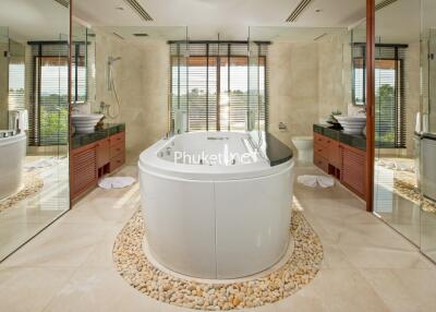 Luxurious bathroom with central freestanding bathtub