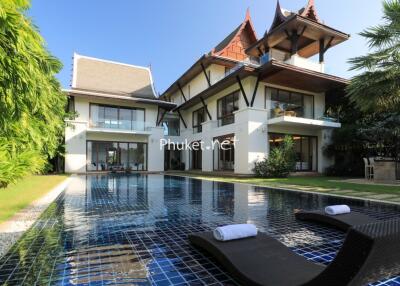 Exterior view of a luxurious house with a swimming pool