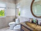 Modern bathroom with large mirror and a window view