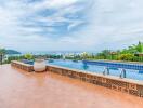 Outdoor area with pool and ocean view