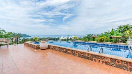 Outdoor area with pool and ocean view