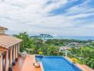 Outdoor area with swimming pool and sea view