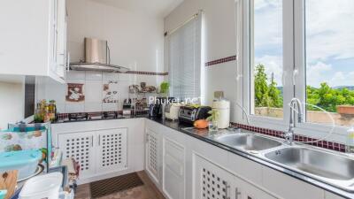 Well-equipped kitchen with natural light