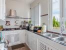 Well-equipped kitchen with natural light